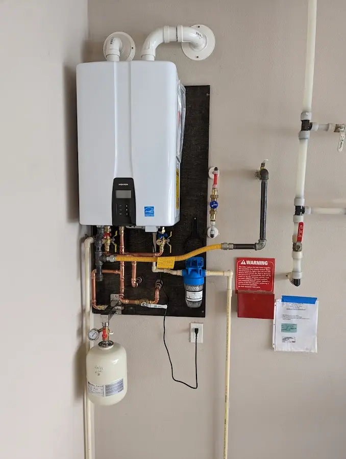 Professional plumber installing copper piping in a Bakersfield home